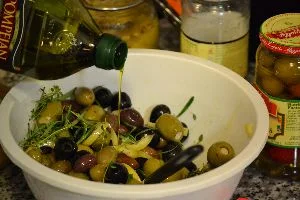 Adding the olive oil to the ingredients_small